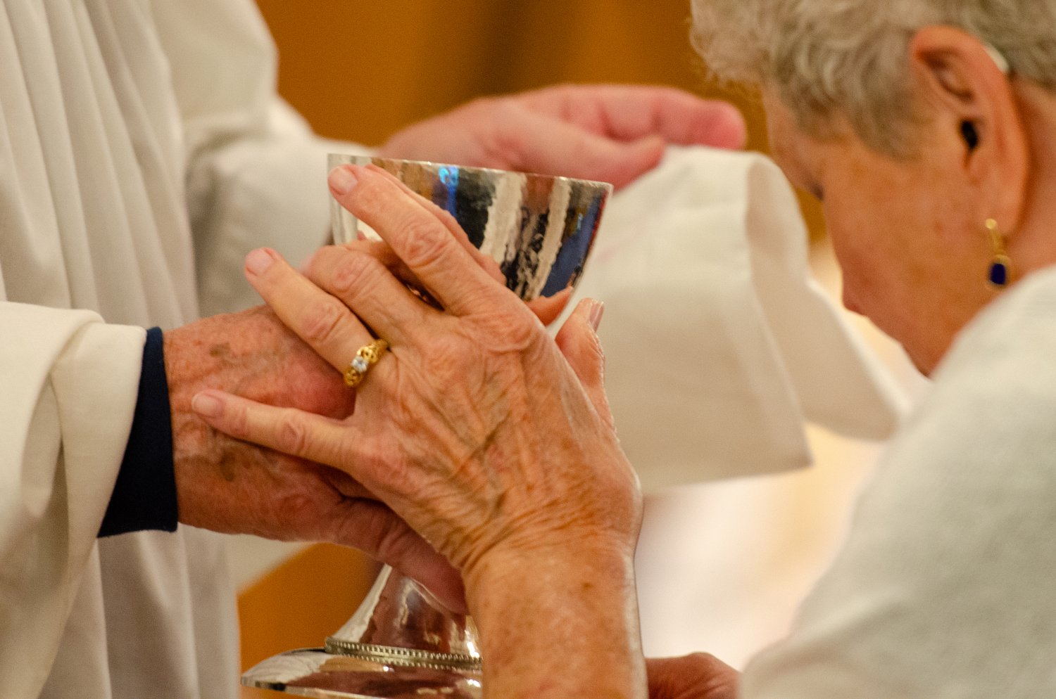 Woman receiving the cup during communion
