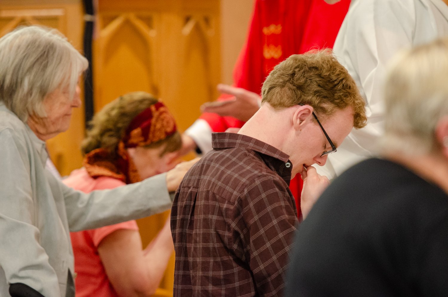 Man eating the wafer at communion