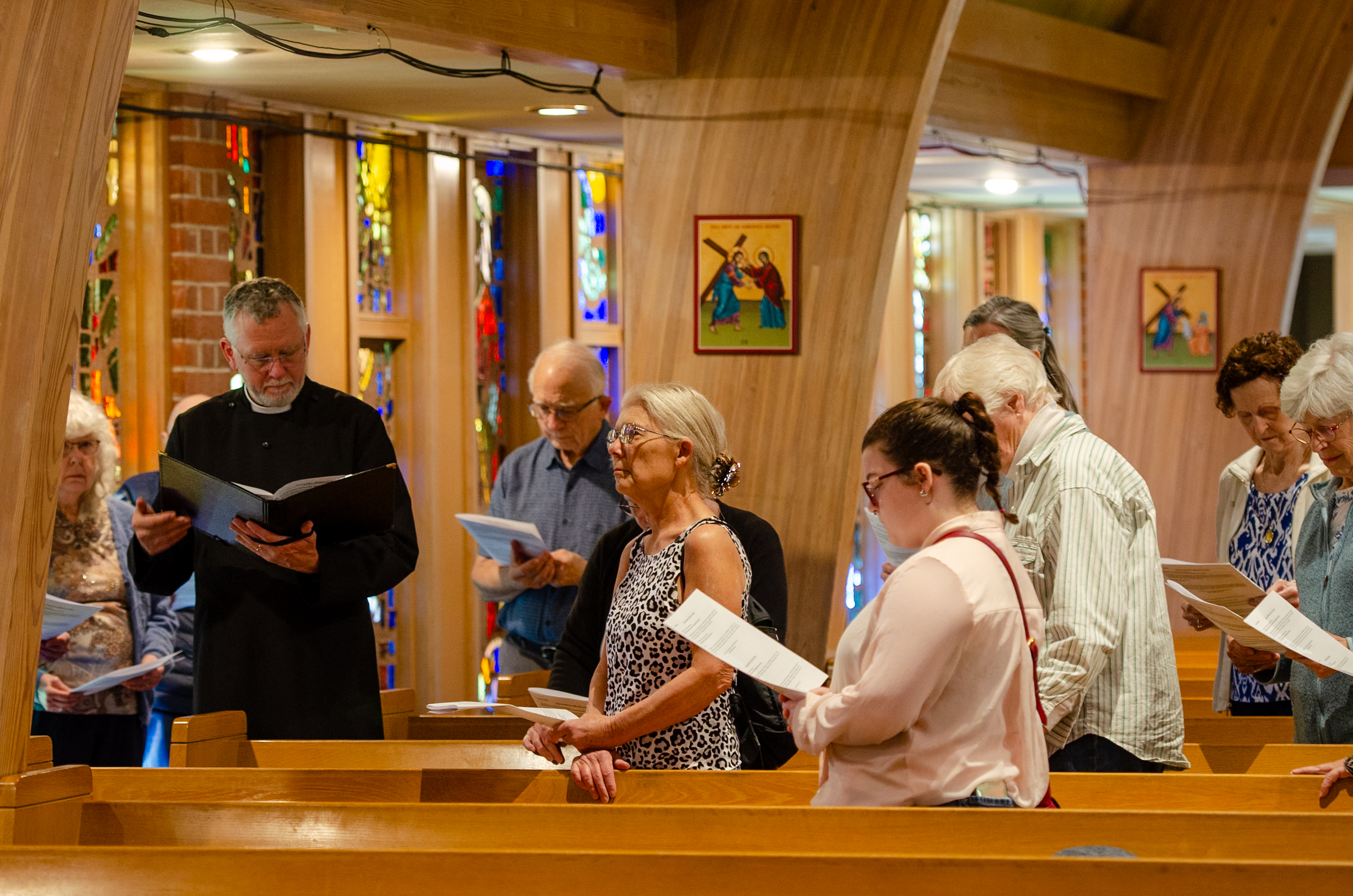 People praying the stations of the cross together