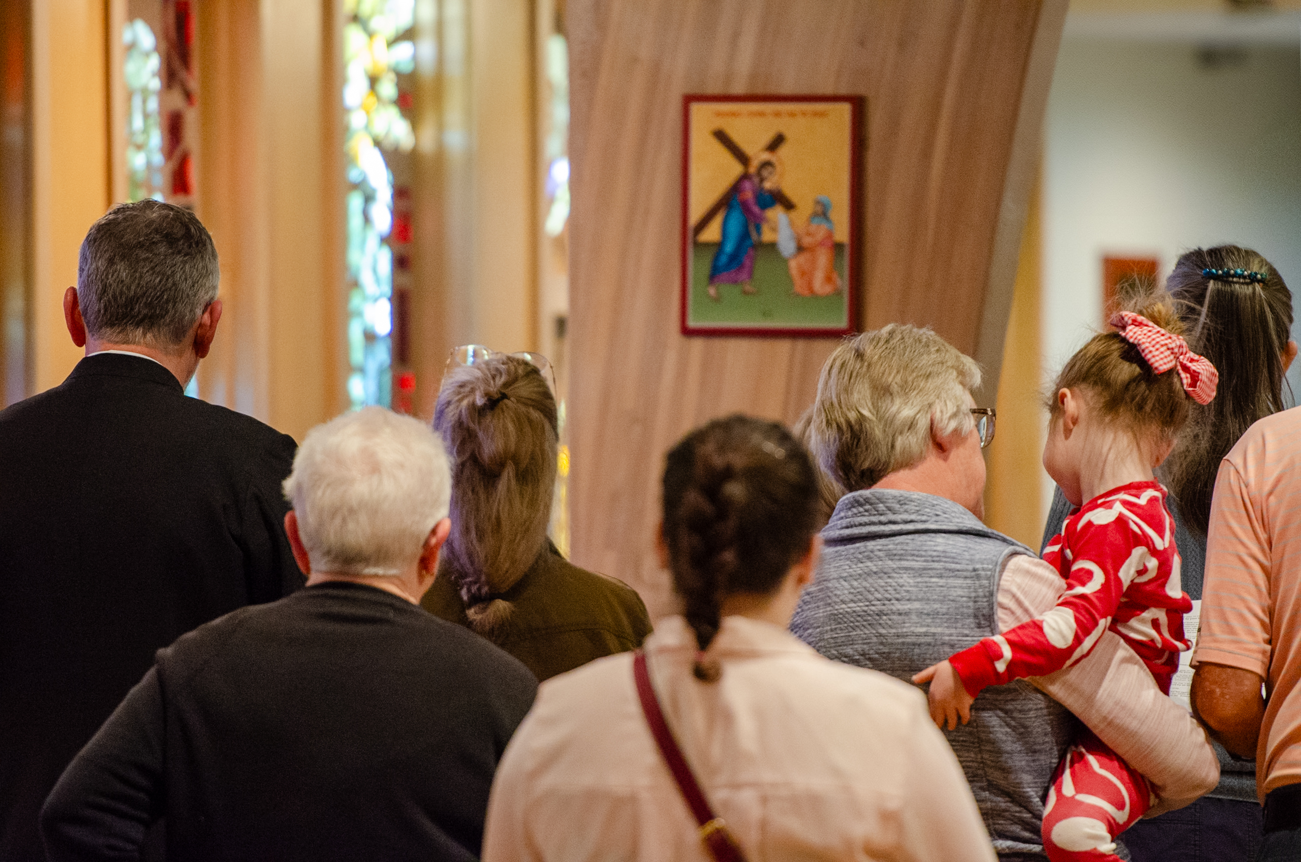 People praying the stations of the cross together