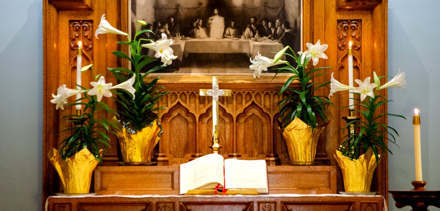 White flowers on the chapel altar at Good Sam