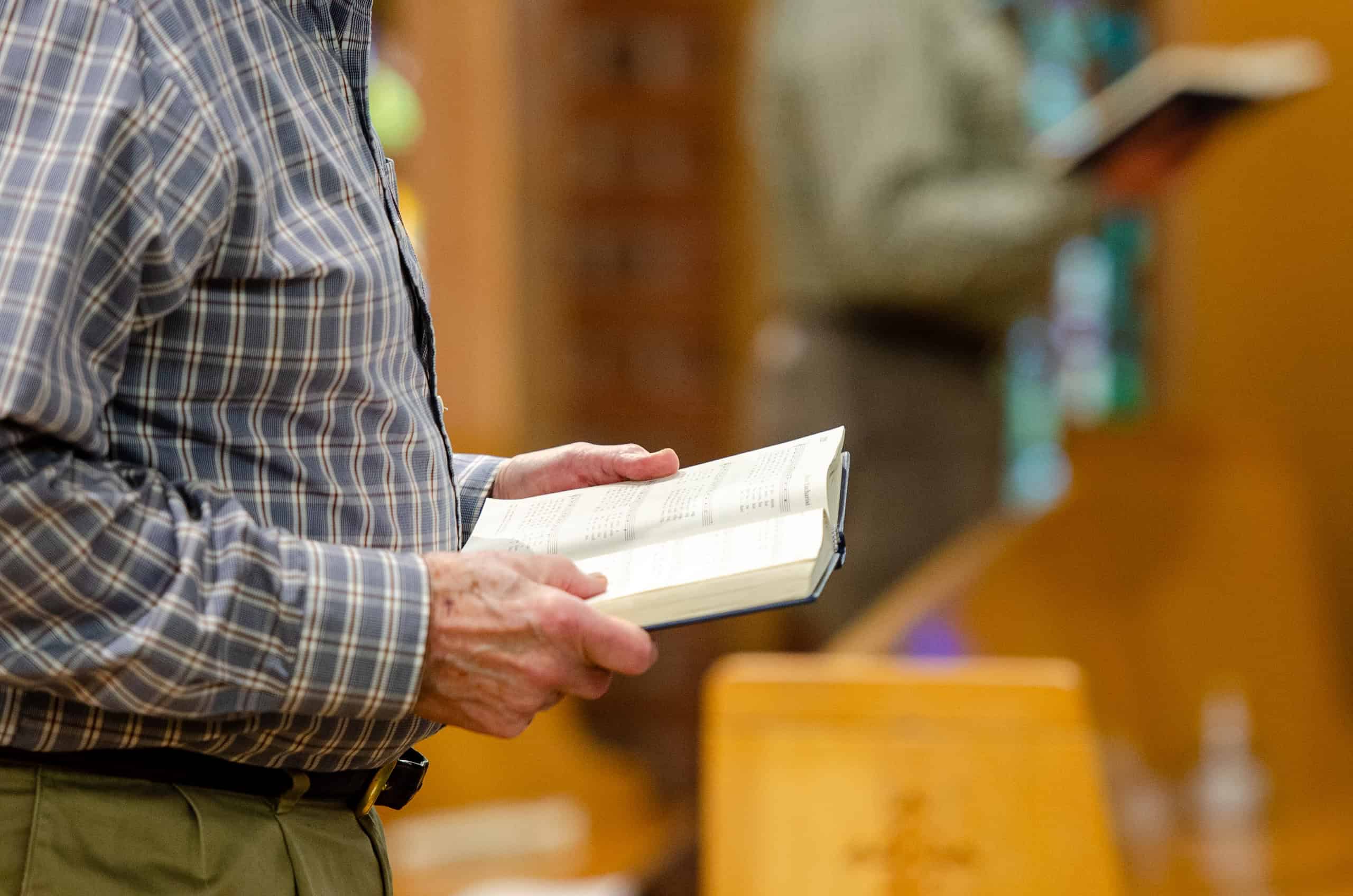 Congregation reading scripture during church service at The Episcopal Church of the Good Samaritan.