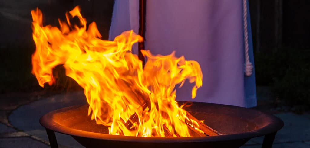 Fire pit with flames at The Episcopal Church of the Good Samaritan.