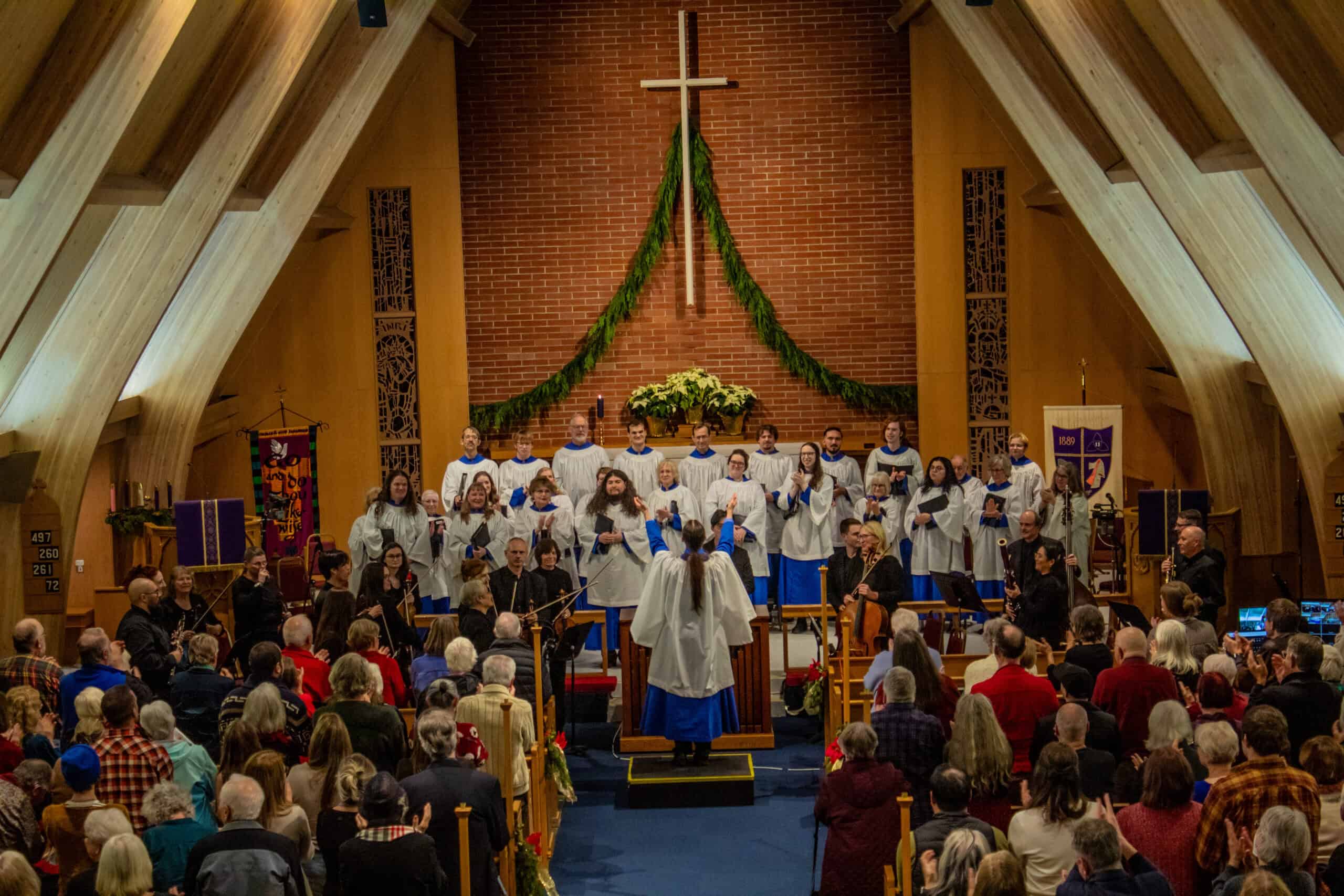 Episcopal church service with clergy and congregation during a religious ceremony.