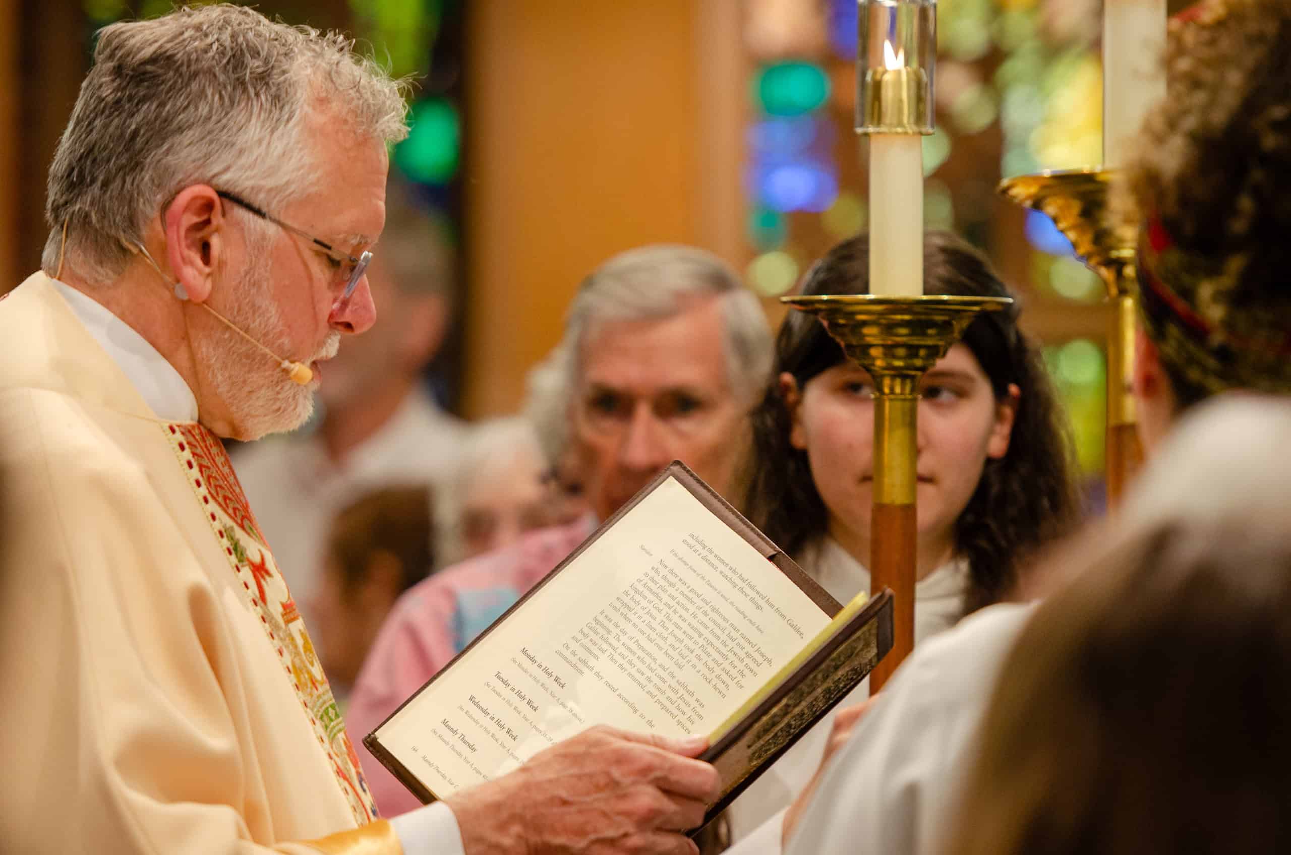 Congregation members praying during a church service at The Episcopal Church of the Good Samaritan.