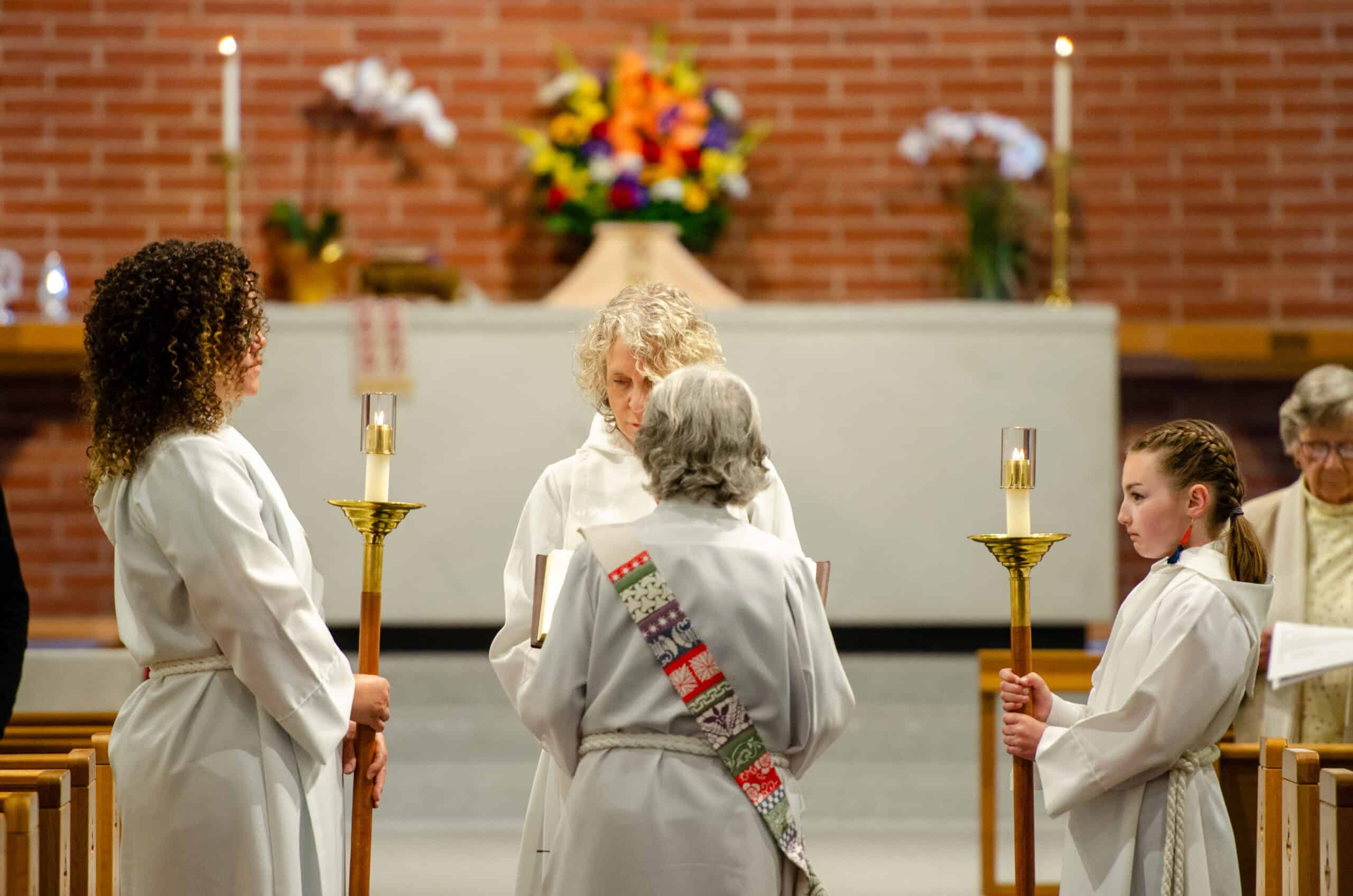 Episcopal church service with clergy and congregation during a religious ceremony.